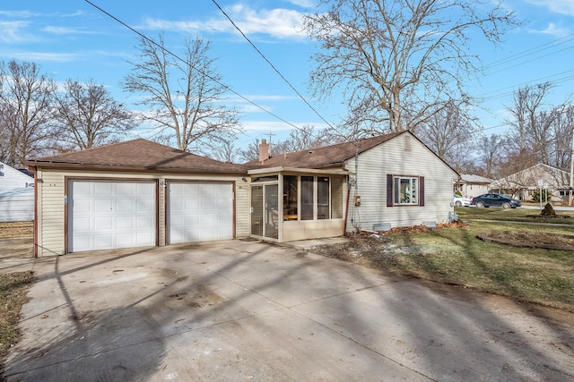 view of front of house featuring a front yard and a sunroom