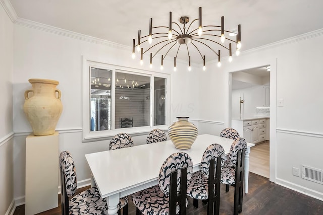 dining area featuring ornamental molding and dark hardwood / wood-style floors