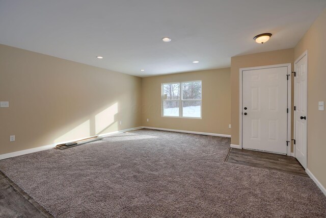 interior space with dark colored carpet