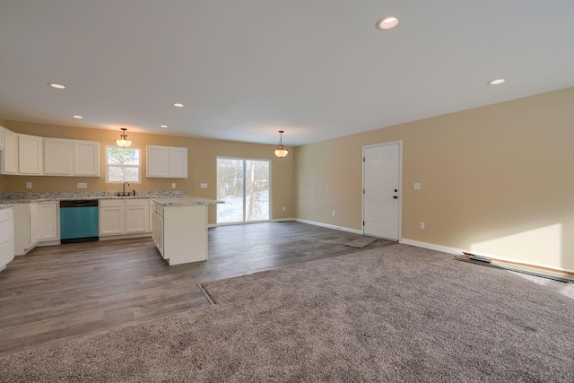 kitchen with decorative light fixtures, sink, white cabinets, and dishwasher