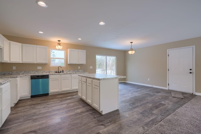 kitchen featuring pendant lighting, dishwasher, dark hardwood / wood-style flooring, sink, and white cabinetry