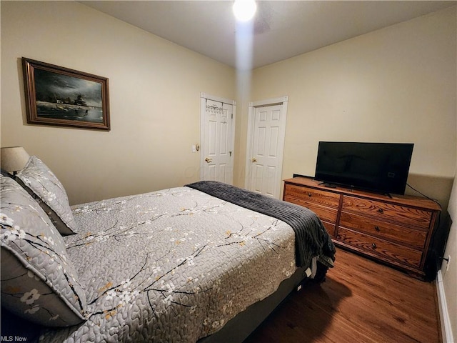 bedroom with hardwood / wood-style floors