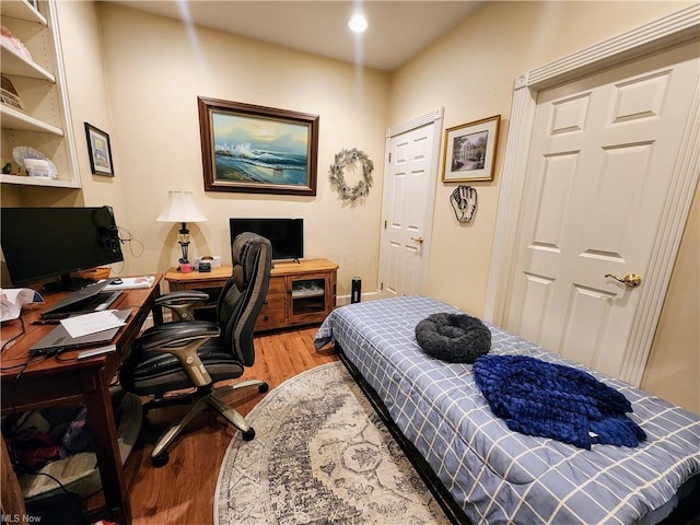 bedroom featuring hardwood / wood-style flooring