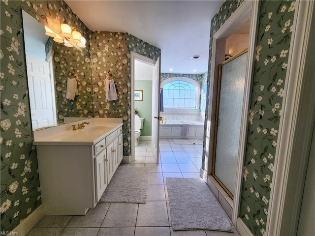 full bathroom with vanity, toilet, tile patterned flooring, and plus walk in shower