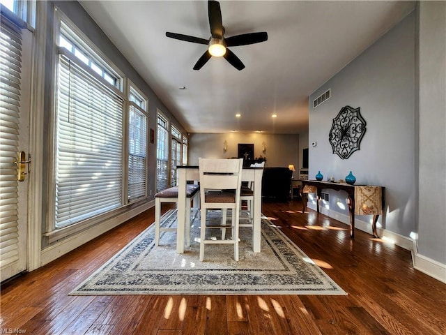 dining room featuring dark hardwood / wood-style floors and ceiling fan