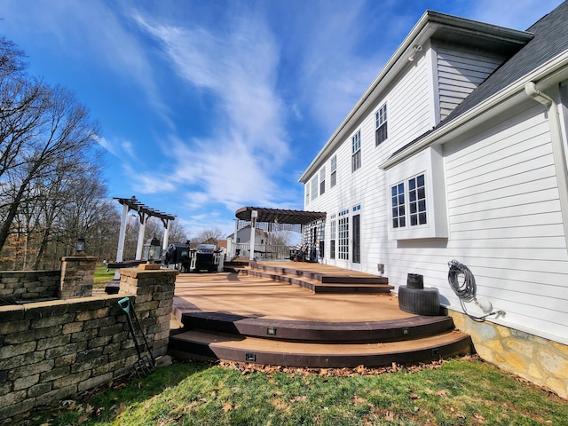 wooden deck featuring a pergola