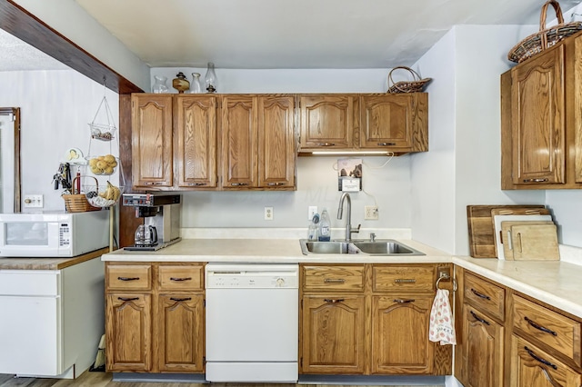 kitchen featuring sink and white appliances