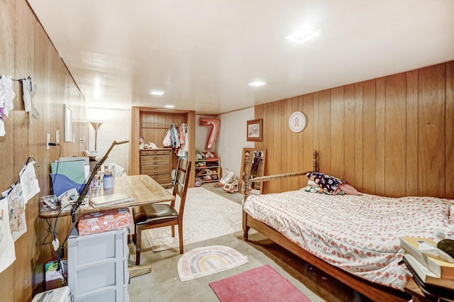 bedroom featuring wooden walls