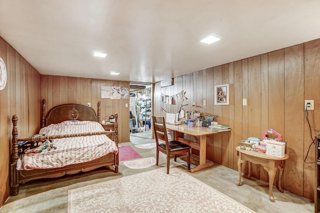 bedroom with wood walls