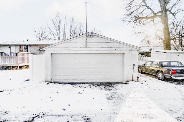 view of snow covered garage