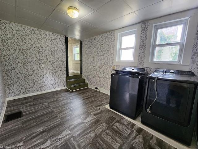 clothes washing area featuring independent washer and dryer