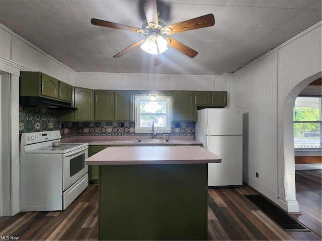 kitchen with dark hardwood / wood-style floors, sink, white appliances, and green cabinetry