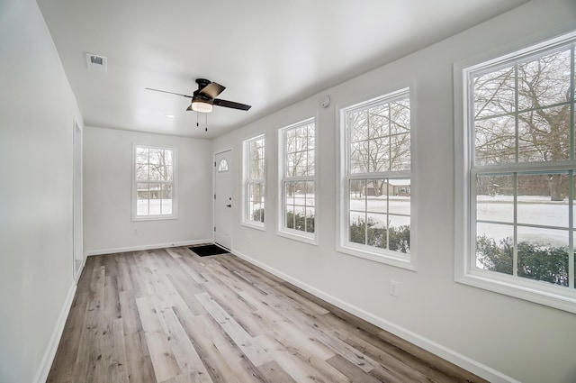 interior space featuring ceiling fan and light wood-type flooring