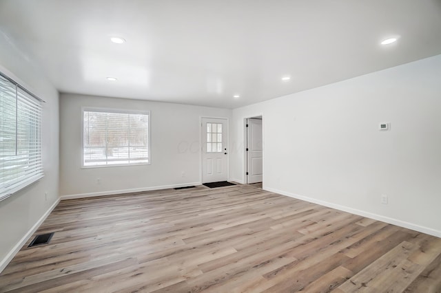 unfurnished room featuring light wood-type flooring