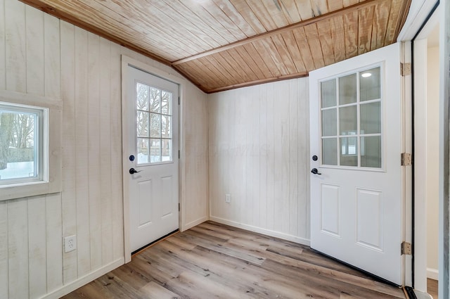 doorway with a healthy amount of sunlight, wooden ceiling, lofted ceiling, and light wood-type flooring