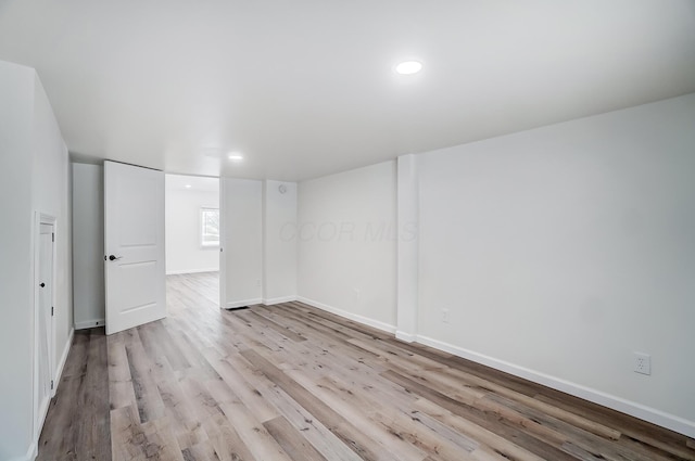 unfurnished room featuring light hardwood / wood-style flooring