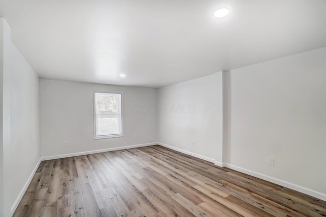 spare room featuring light hardwood / wood-style flooring