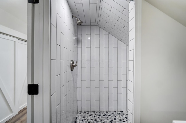 bathroom with tiled shower