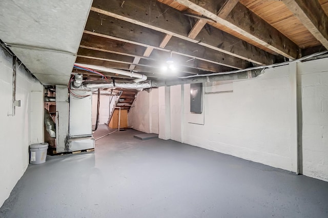 basement with heating unit and electric panel