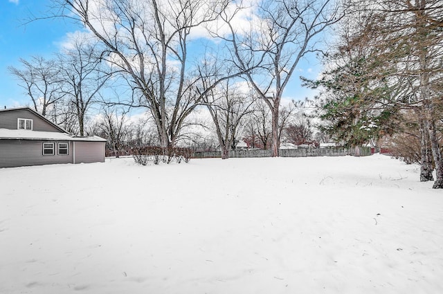 view of yard layered in snow