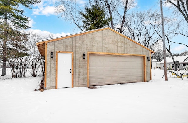 view of snow covered garage