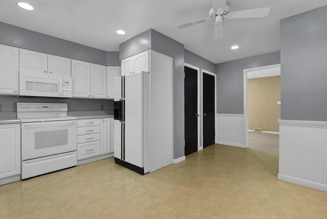 kitchen featuring ceiling fan, white cabinetry, and white appliances