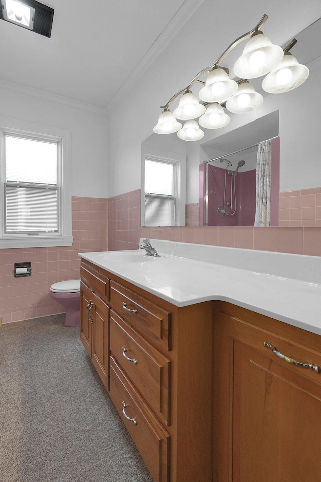 bathroom featuring toilet, crown molding, tile walls, a shower with shower curtain, and vanity