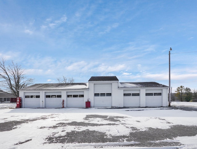 view of snow covered garage