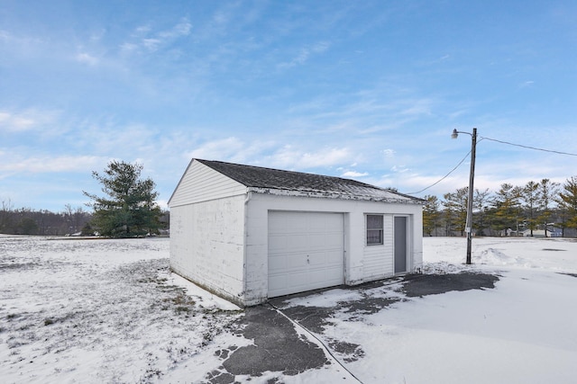 view of snow covered garage