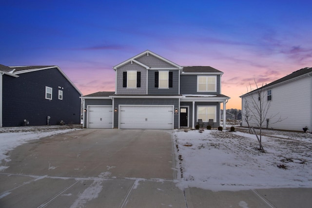 front of property with a garage