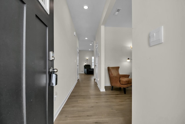 corridor featuring light hardwood / wood-style floors