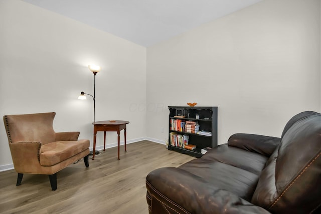 sitting room with hardwood / wood-style floors