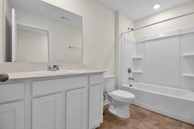 full bathroom with vanity, toilet, and bathtub / shower combination