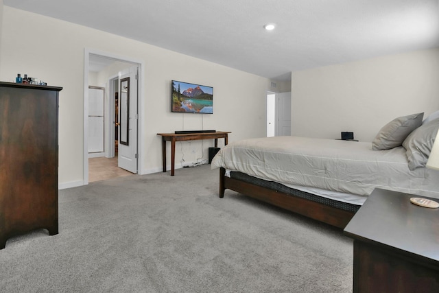 bedroom featuring light colored carpet