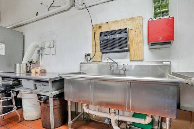 kitchen featuring a wall mounted air conditioner and tile patterned flooring