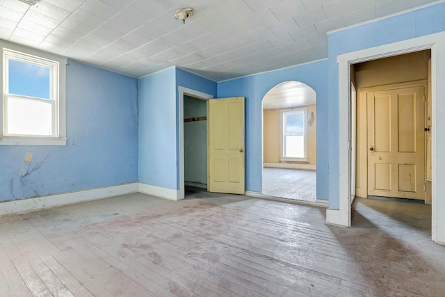 unfurnished room with wood-type flooring