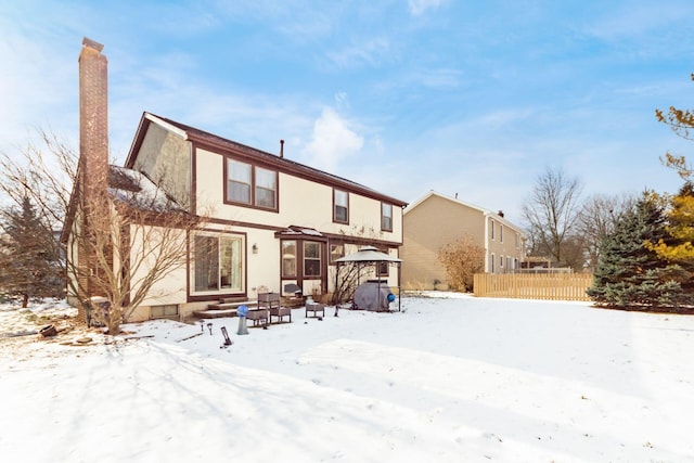 view of snow covered house