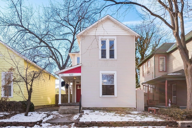 view of snow covered rear of property