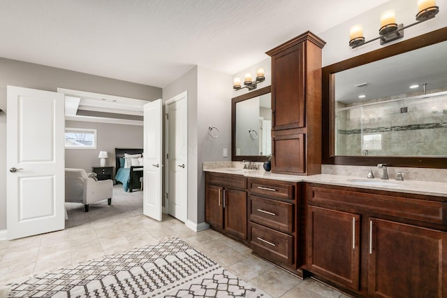 bathroom with tile patterned floors, vanity, and an enclosed shower