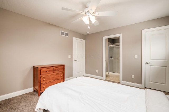 carpeted bedroom with ceiling fan and ensuite bathroom