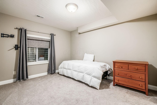 bedroom with light carpet