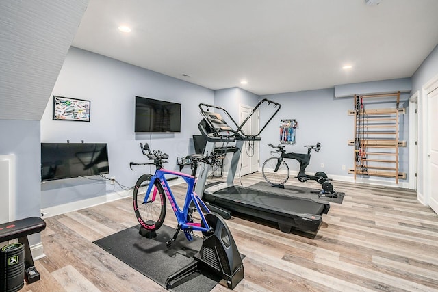 workout room with light wood-type flooring