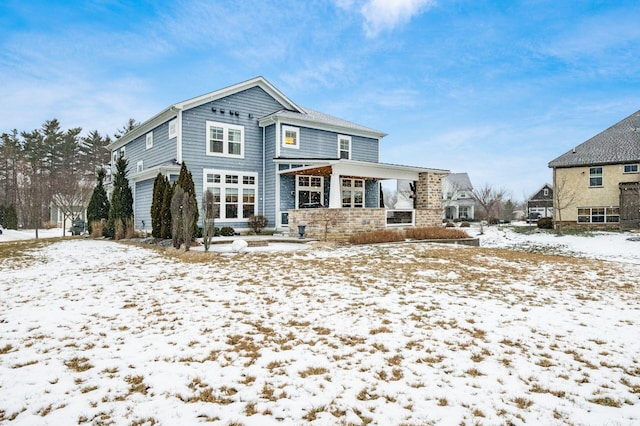 view of snow covered house