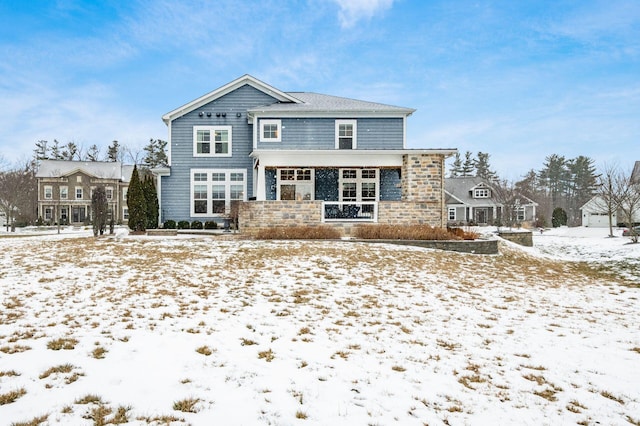 view of snow covered house