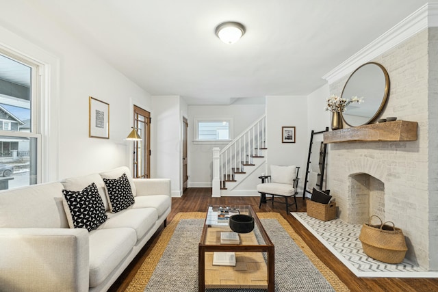 living room featuring dark hardwood / wood-style flooring and a fireplace