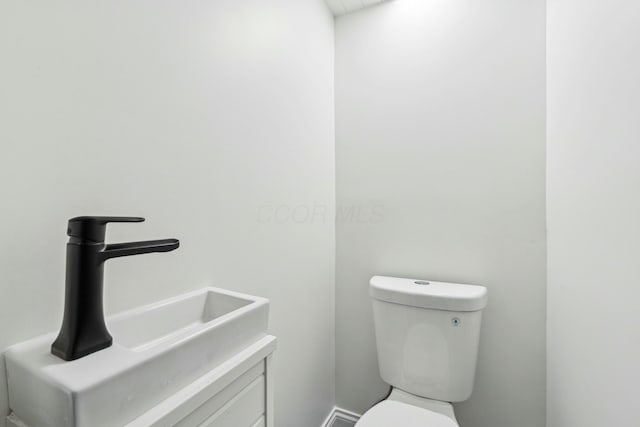 bathroom with toilet and sink