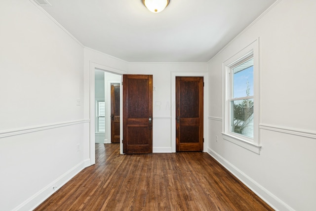 unfurnished bedroom with dark hardwood / wood-style floors