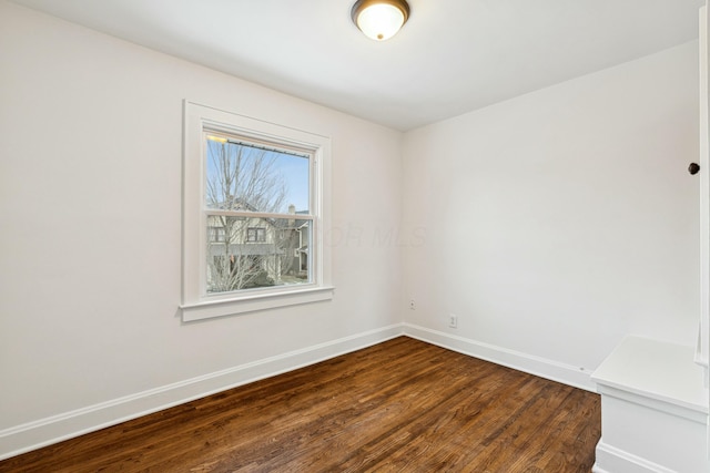 spare room featuring hardwood / wood-style floors