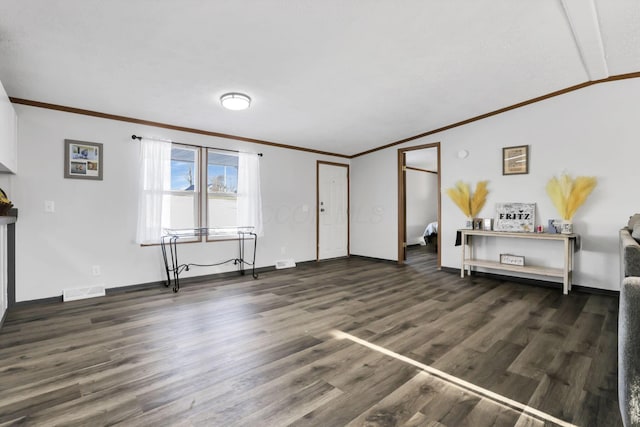 unfurnished living room featuring dark wood-type flooring and crown molding