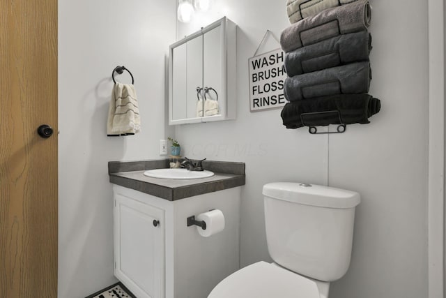 bathroom with vanity and toilet